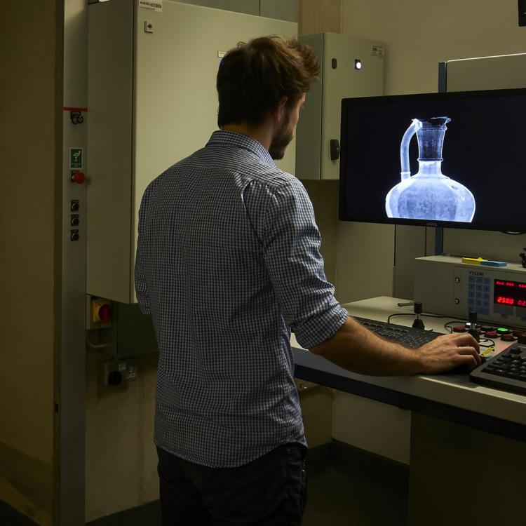 Scientist conducting x-ray imaging on an artefact at work at the Department of Scientific Research