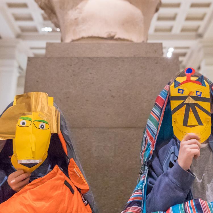 Two children at a Young Friends Sleepover wearing masks