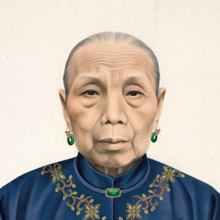 Ink and colour picture showing the head and shoulders of an elderly Chinese woman with her hair tied back. She is wearing green earrings and a blue jacket decorated with gold leaves around the neck. 