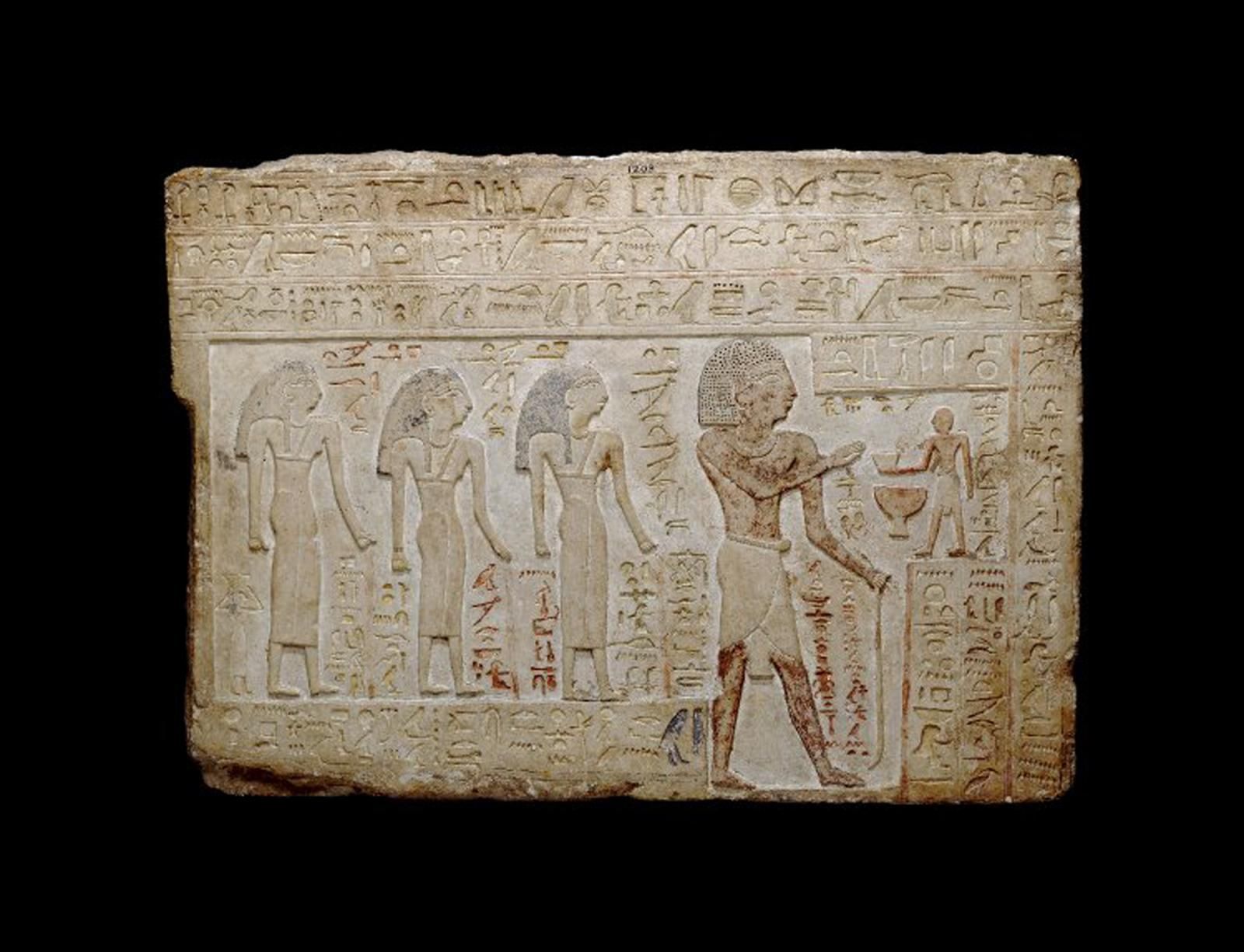 Five people, one small, three large, one larger depicting a scene from Egypt.