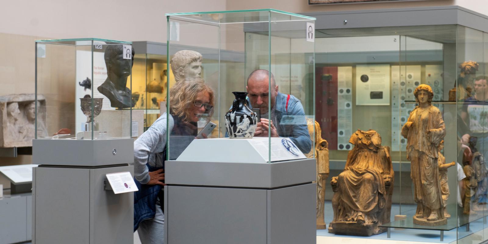 Visitors in Room 70 photographing the Portland Vase