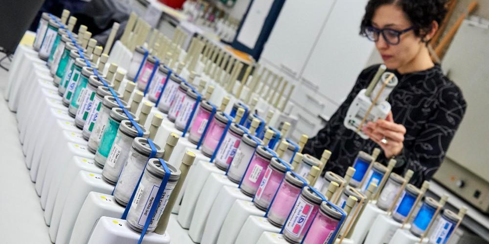 A woman and a table covered in environmental sensors. 