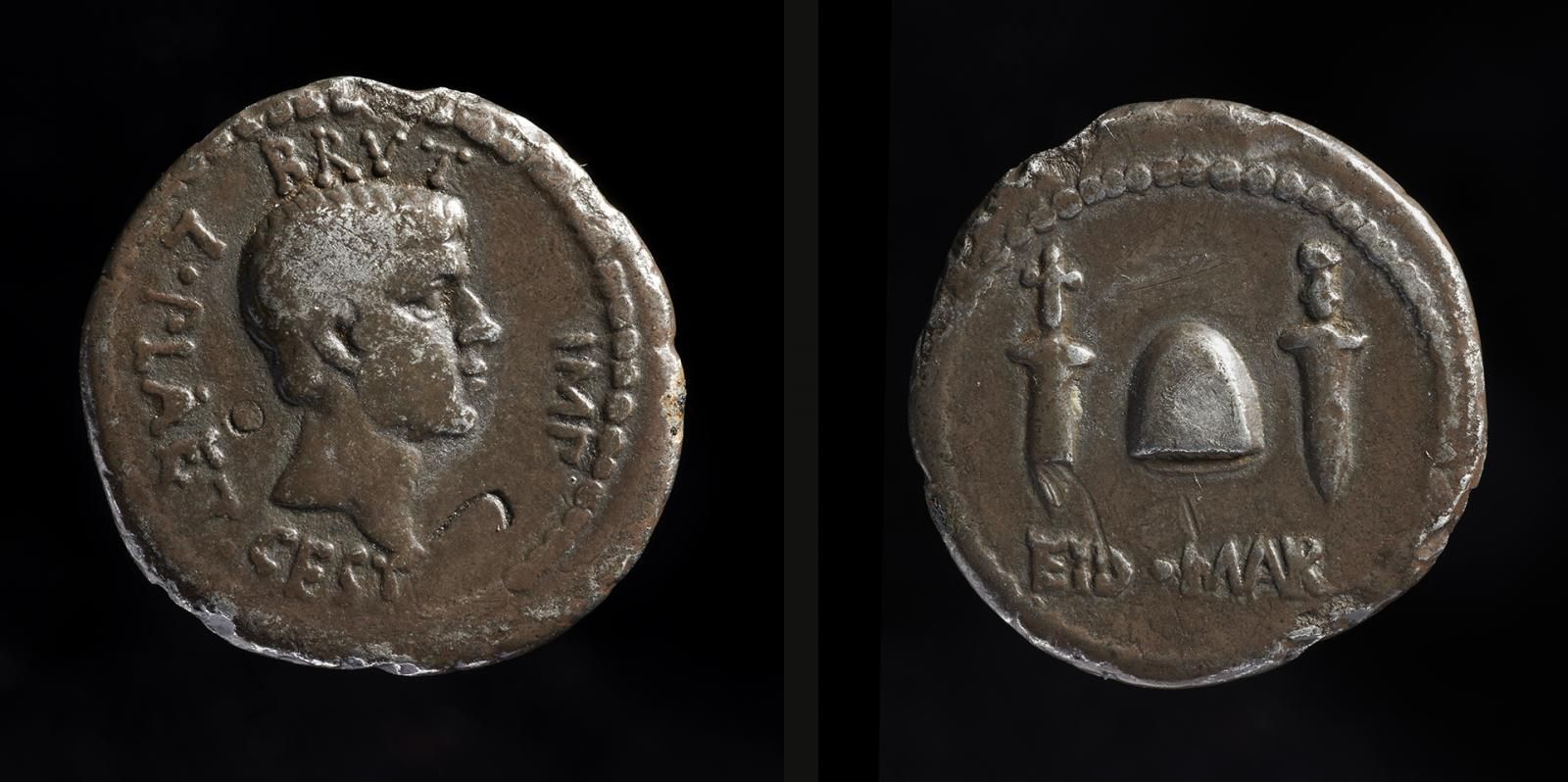 Two sides of a silver, front with the face of Brutus and on the reverse the ‘cap of liberty’ between two daggers and an inscription EID MAR.