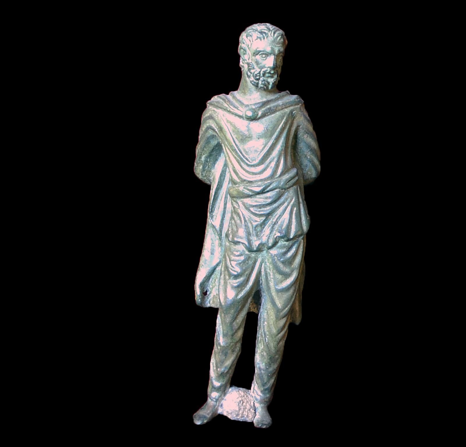 Statuette of a bearded clothed man with his hands tied behind his back