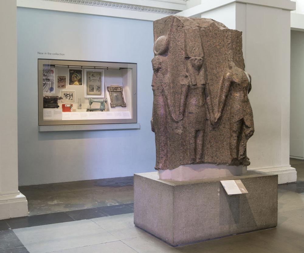 Display case in a gallery containing ten objects