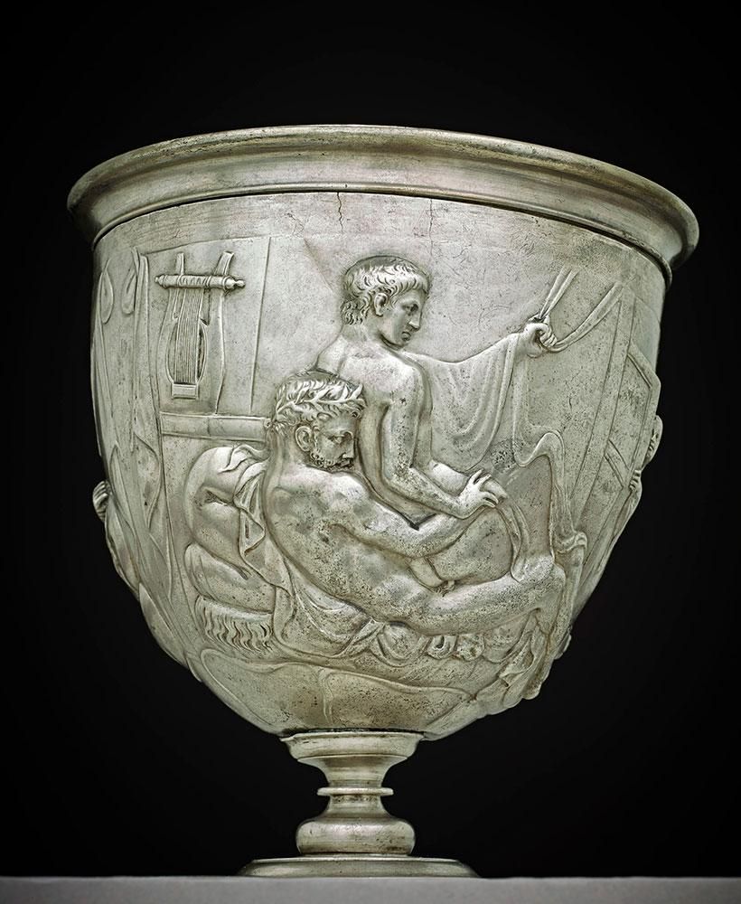 A silver stemmed drinking-cup with scene of two men love-making