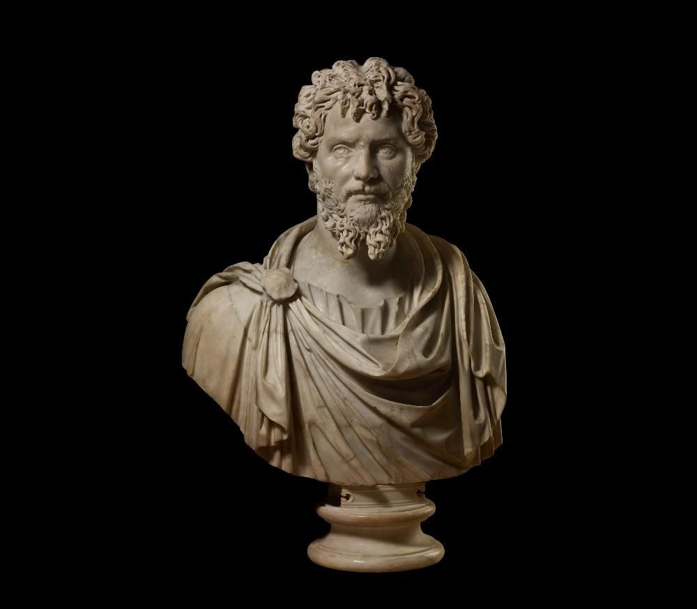 Marble portrait bust of bearded emperor Septimius Severus.