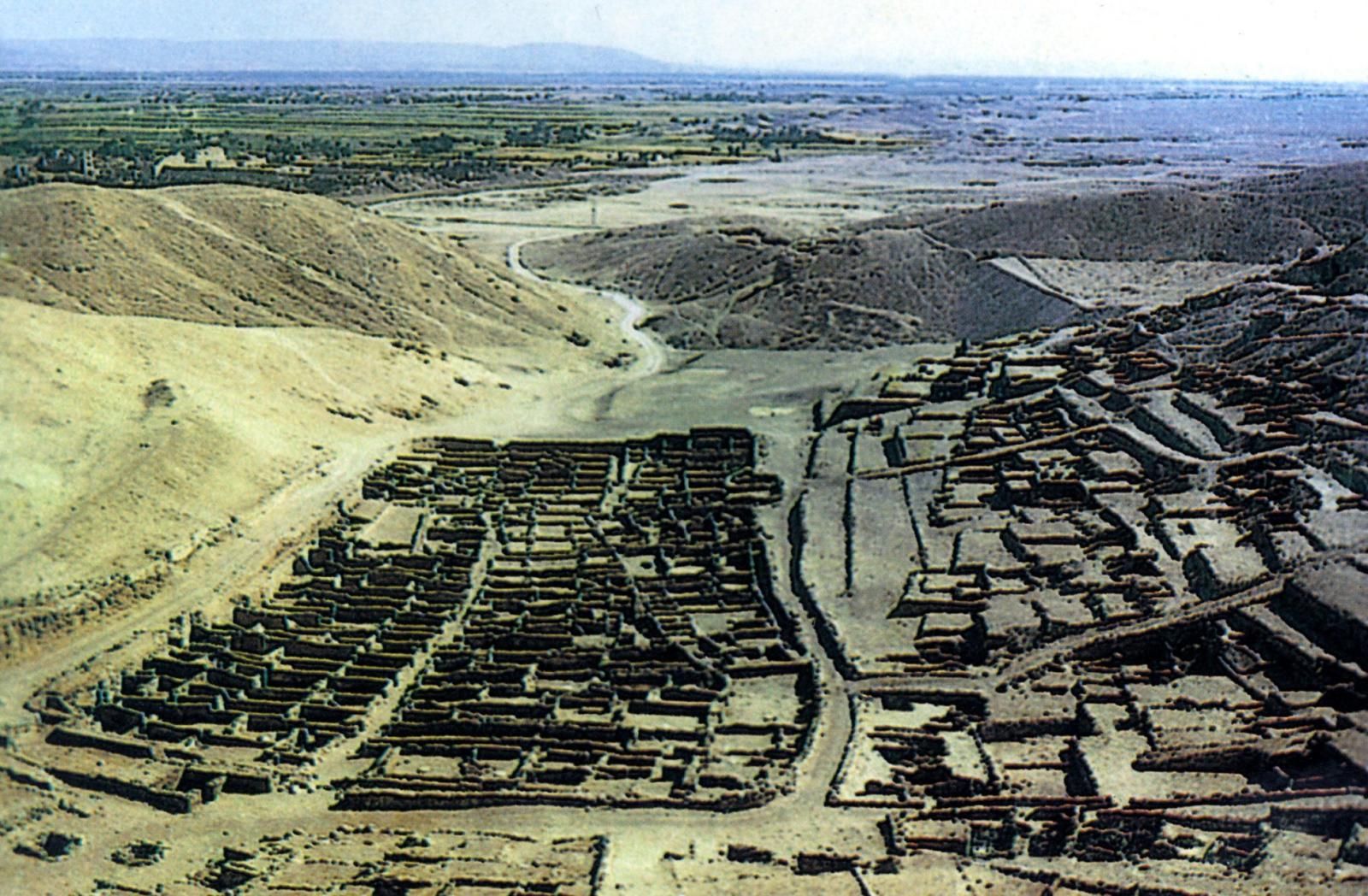 Postcard of photograph showing the Deir el-Medina, or ancient workmens' village, beneath the cliffs at Thebes