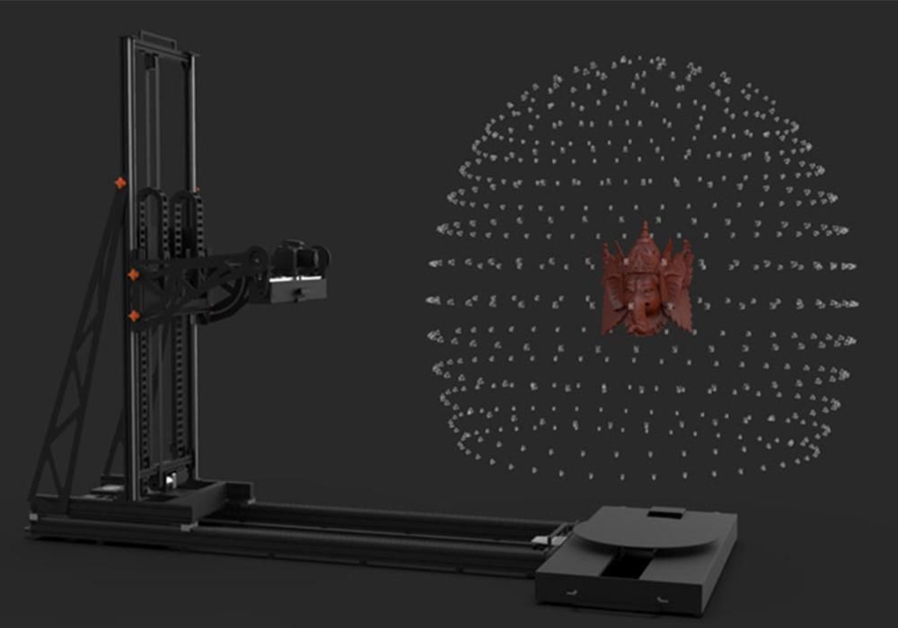 A dark metal rig and a sphere of white dots surrounding a clay object. 