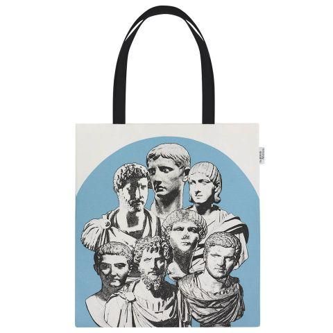 A tote bag with the busts of Roman emperors depicted against a pale blue background