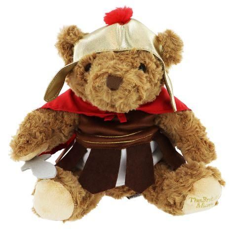 A teddy bear soft toy in a Roman soldier costume, with gold helmet, red cloak and brown tunic