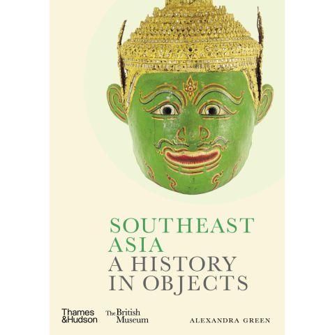 Book cover with image of the head of a Buddha with a green face and gold head covering. 