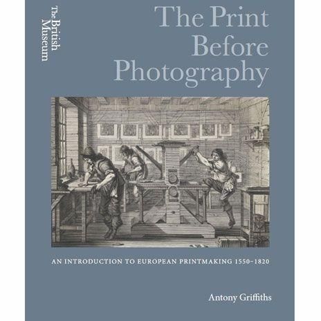 Grey book cover with a reproduction of an illustration of an old printing press, including three workers. 